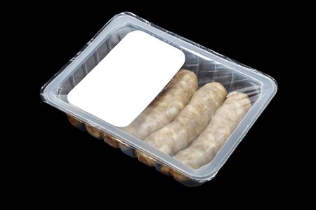 kupaty (bratwursts) in modified atmosphere packaging (MAP) on the black backgroundの写真素材