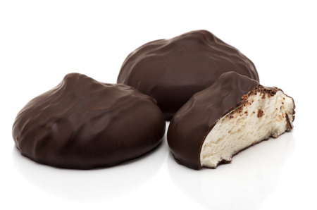 chocolate covered marshmallows on white backgroundの写真素材