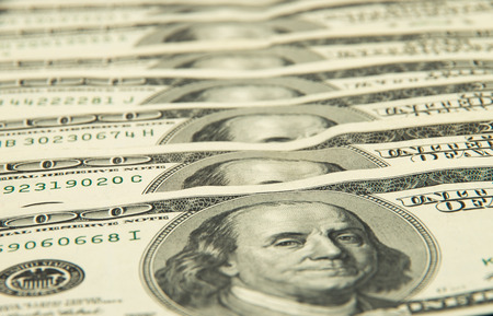One hundred dollars pile as background.の写真素材