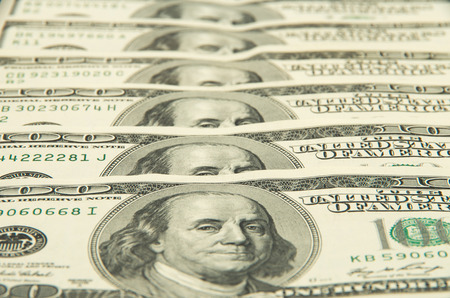 One hundred dollars pile as background.の写真素材