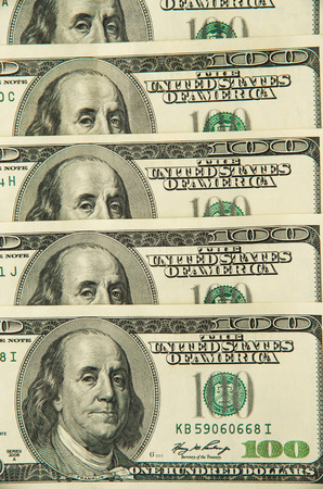 One hundred dollars pile as background.の写真素材