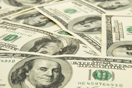 One hundred dollars pile as background.の写真素材