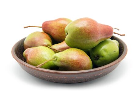 Pears in bowl on white backgroundの写真素材