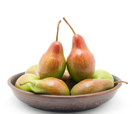 Pears in bowl on white backgroundの写真素材