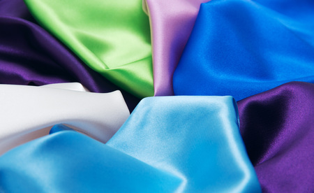 heap of cloth fabrics, close upの写真素材