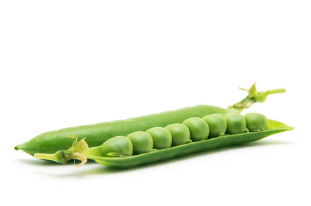 fresh green peas isolated on a white backgroundの写真素材