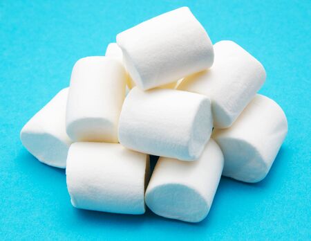 heap of marshmallow on blueの写真素材