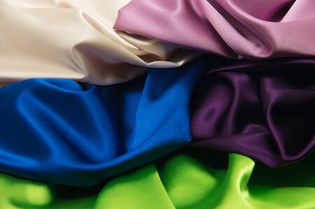 heap of cloth fabrics, close upの写真素材