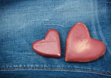 Red hearts on the jeans.の写真素材