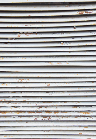 steel ventilation grille on the wall of a buildingの写真素材