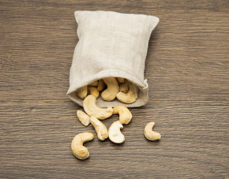 cashew nuts in a textile sackの写真素材