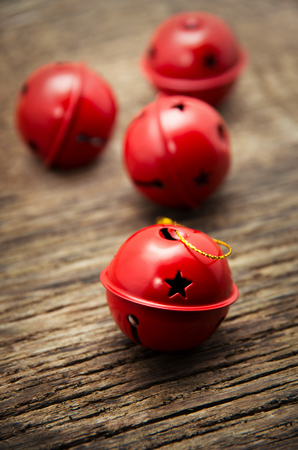 Christmas Jingle bells on a rustic wooden backgroundの写真素材