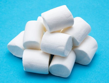 heap of marshmallow on blueの写真素材