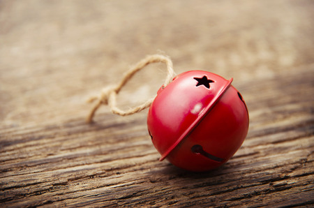 Christmas Jingle bells on a rustic wooden backgroundの写真素材