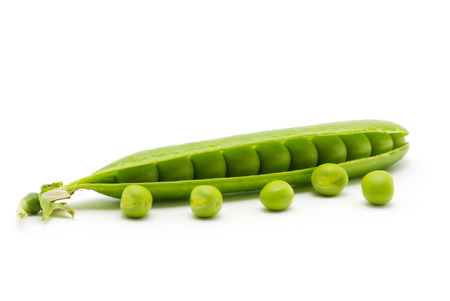 fresh green peas isolated on a white backgroundの写真素材