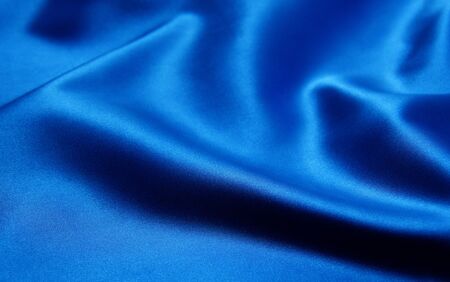 Smooth elegant blue silk can use as backgroundの写真素材
