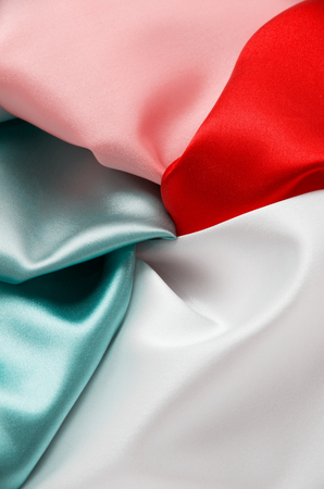 heap of cloth fabrics, close upの写真素材
