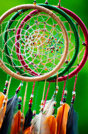 Dream catcher with feathers threads and beads rope hanging.の写真素材
