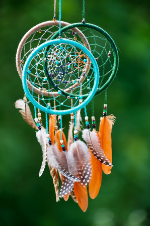 Dream catcher with feathers threads and beads rope hanging.の写真素材