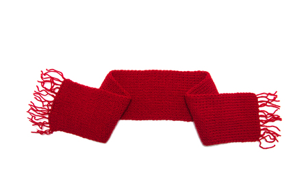 Red knitted scarf on a white background.の写真素材