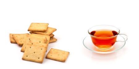 Cup of tea and cookies isolated on whiteの写真素材