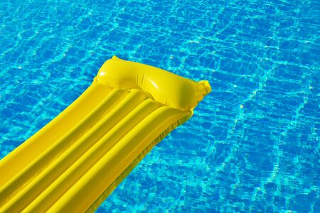 Air Yellow Mattress On The Water In The Pool