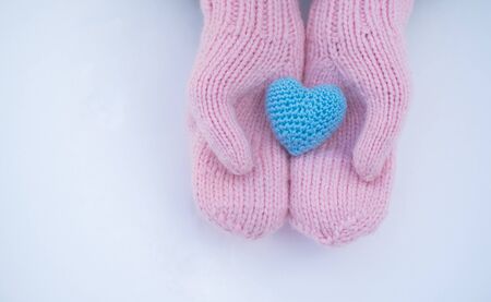 Female hands in mittens with heart, close upの写真素材