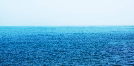 Blue sea with waves and clear blue skyの写真素材