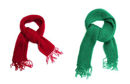 Green and red knitted scarf on a white background.の写真素材