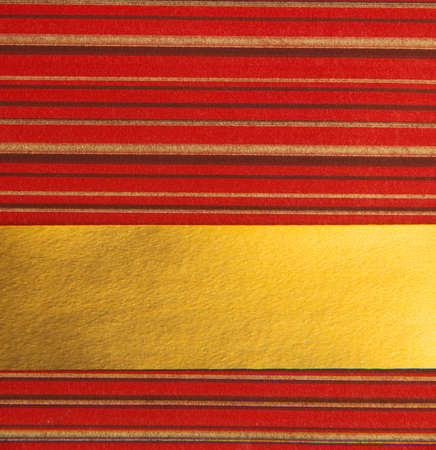 Red background with gold ribbonの写真素材