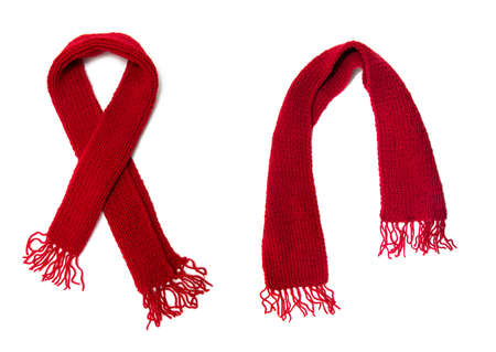 Red knitted scarf on a white background.の写真素材