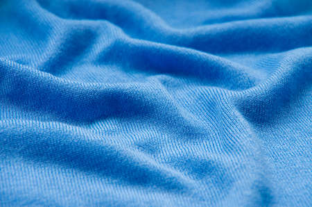 The texture of a knitted woolen fabric blue.の写真素材