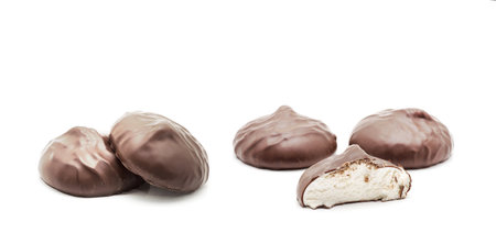 chocolate covered marshmallows on white backgroundの写真素材