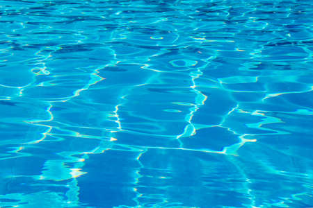 surface of blue swimming pool, background of water in swimming pool.の写真素材