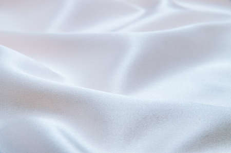 white satin fabric as background textureの写真素材