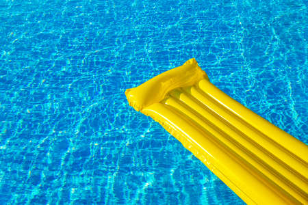 Air Yellow Mattress On The Water In The Poolの写真素材