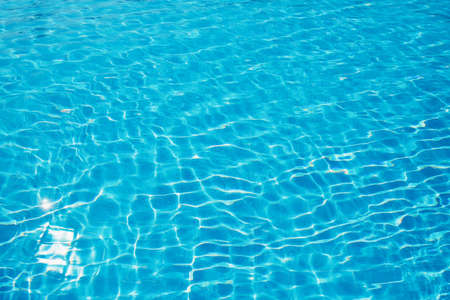 surface of blue swimming pool, background of water in swimming pool.の写真素材