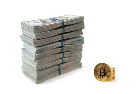 Bitcoin gold coins on US dollar bills.の写真素材