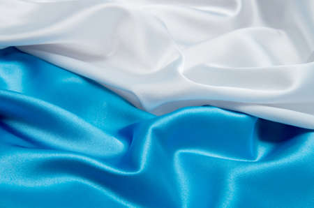 white and blue satin fabric for backgroundの写真素材