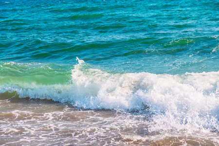 Soft wave of blue sea on sandy beach.の写真素材