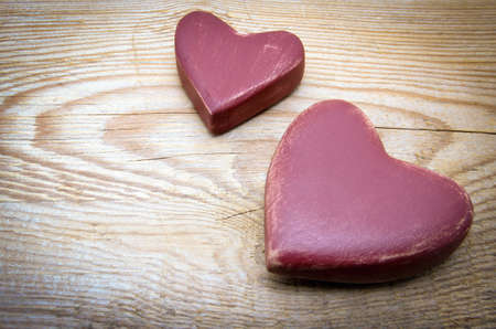 Heart on old shabby wooden backgroundの写真素材