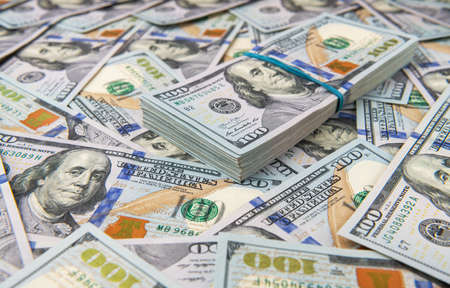 Stack of one hundred dollar bills close-up.の写真素材
