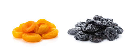 Dried prunes and dried apricots, isolated on white background. Collage of different dried fruits.の写真素材
