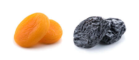 Dried prunes and dried apricots, isolated on white background. Collage of different dried fruits.の写真素材