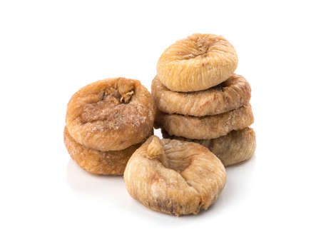 dried fruit figs isolated on white backgroundの写真素材