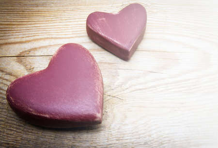 Heart on old shabby wooden background