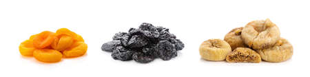 Dried prunes, dried apricots, dried figs isolated on white background. Collage of different dried fruits.の写真素材