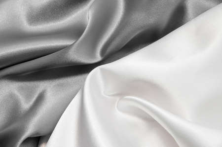 white and gray satin fabric for backgroundの写真素材