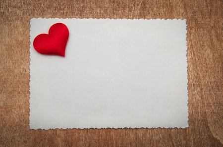 Card with red heart backgroundの写真素材