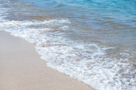 Soft wave of blue sea on sandy beach.の写真素材